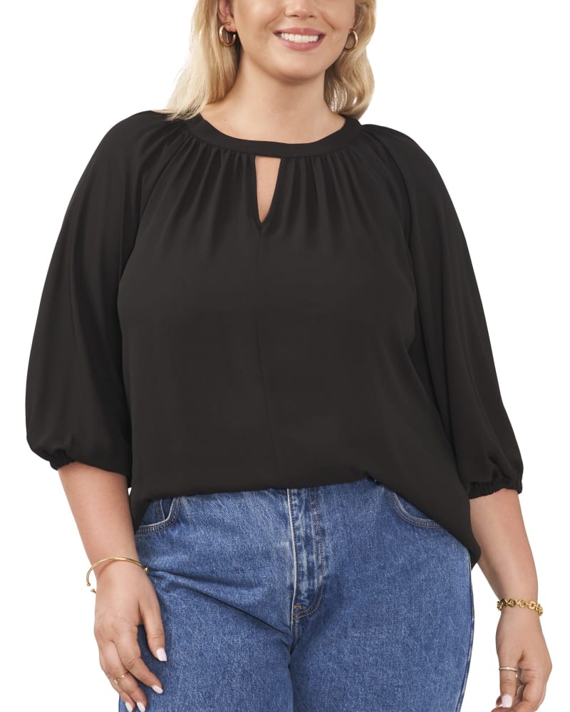 Front of a model wearing a size 1X Amani Keyhole Blouse in RICH BLACK by Vince Camuto. | dia_product_style_image_id:260810